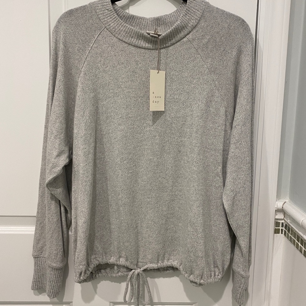 Soft light gray sweater top with tie bottom